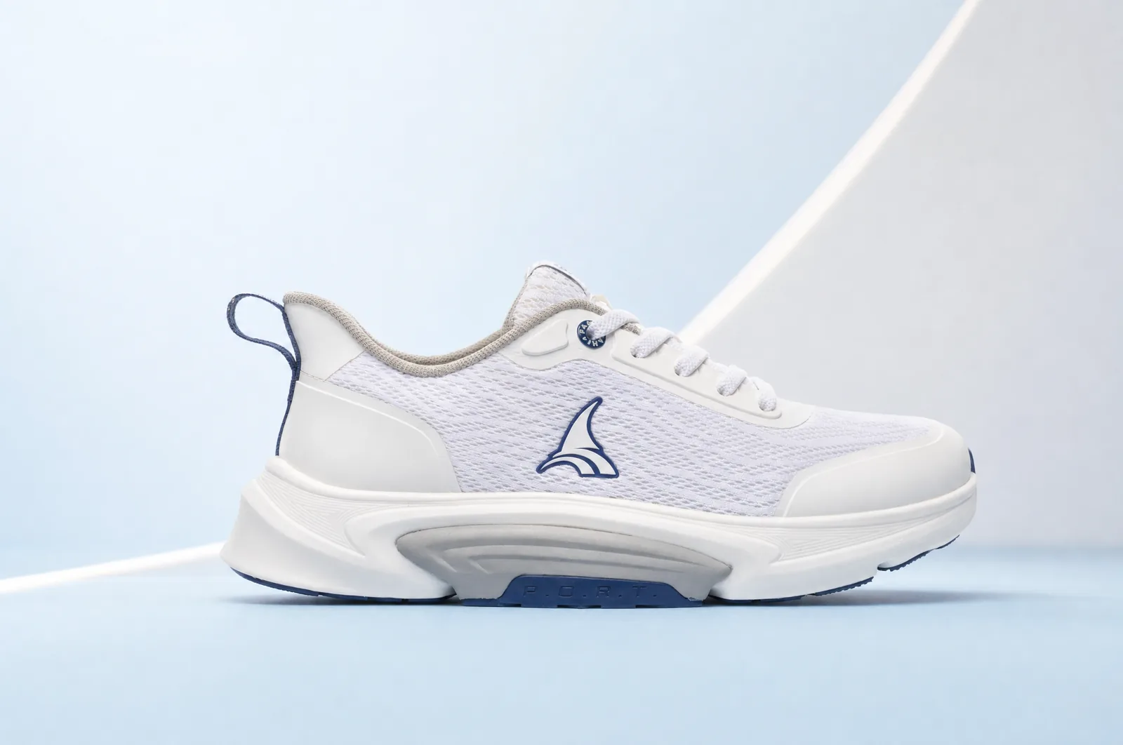 The sole in profile against a plain ground, low and level, so the flare past the upper is the only thing in the frame. Product only. NOTE: the sole-comparison photograph, which is the evidence for the central claim of the funnel, must NOT be used here. Under a scrim with copy over it, a reader cannot measure anything, and evidence that cannot be examined is decoration. It needs its own full-bleed placement with nothing on top of it. FLAGGED, unresolved.